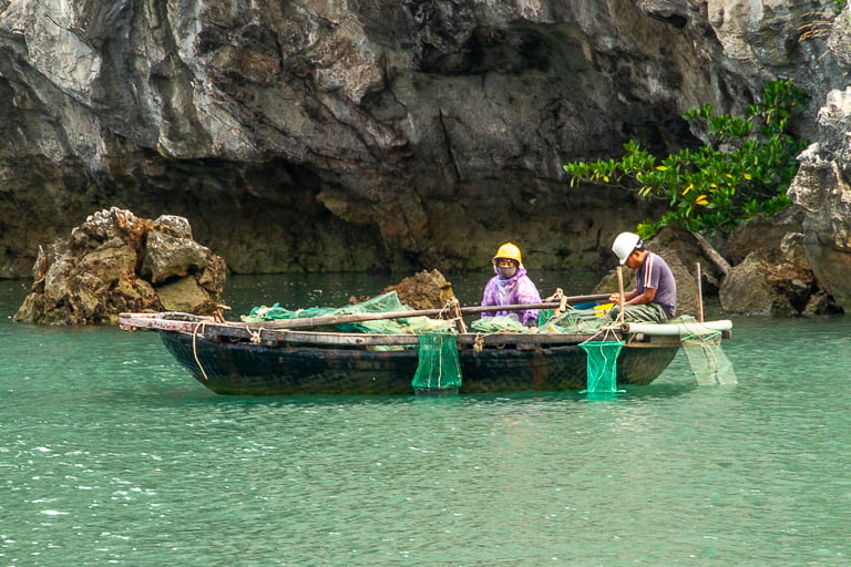 fisherman in halong bay