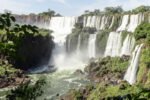 boat approaching Iguazu Falls